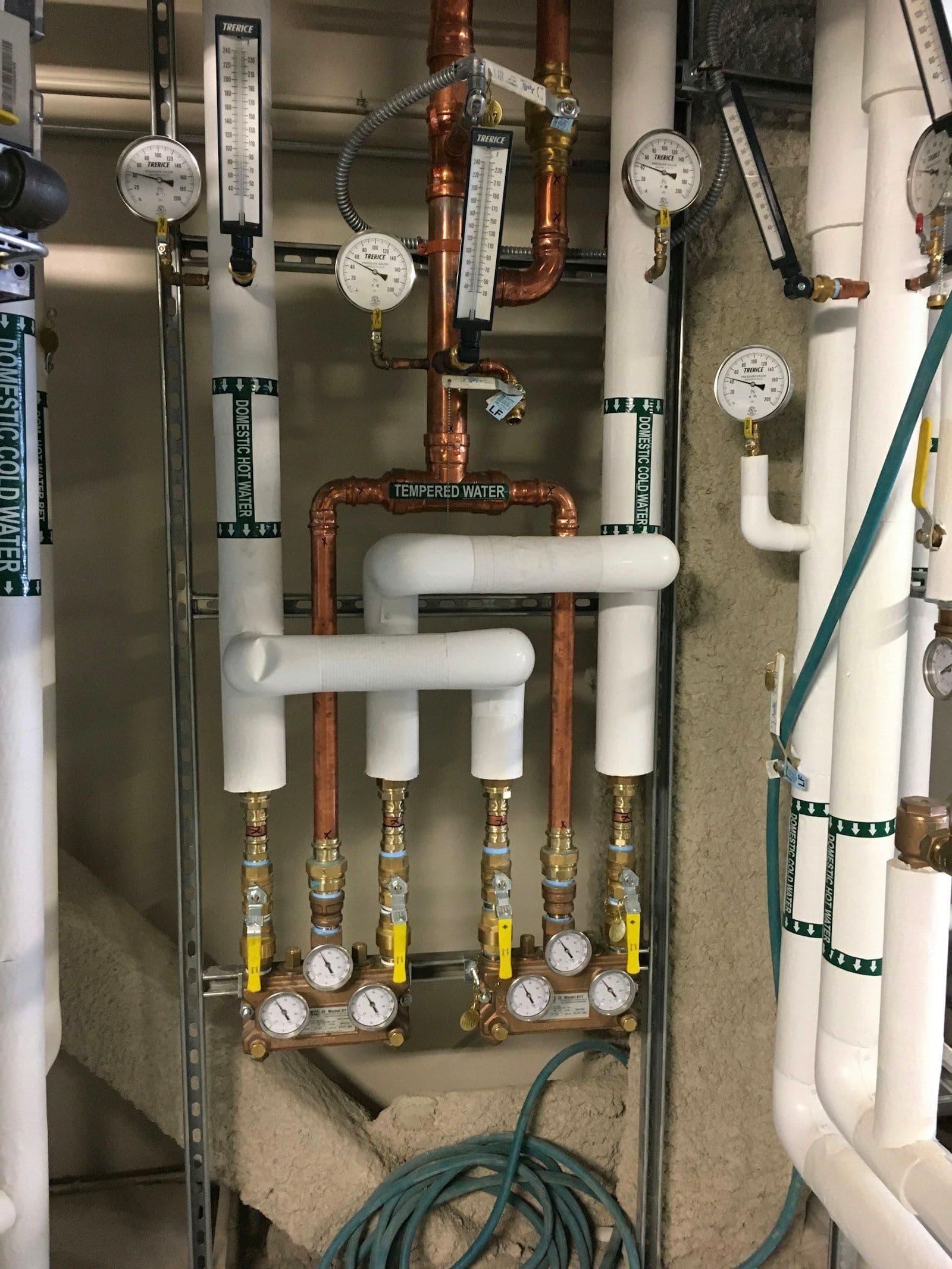 Professional facility manager inspecting building water and mechanical systems