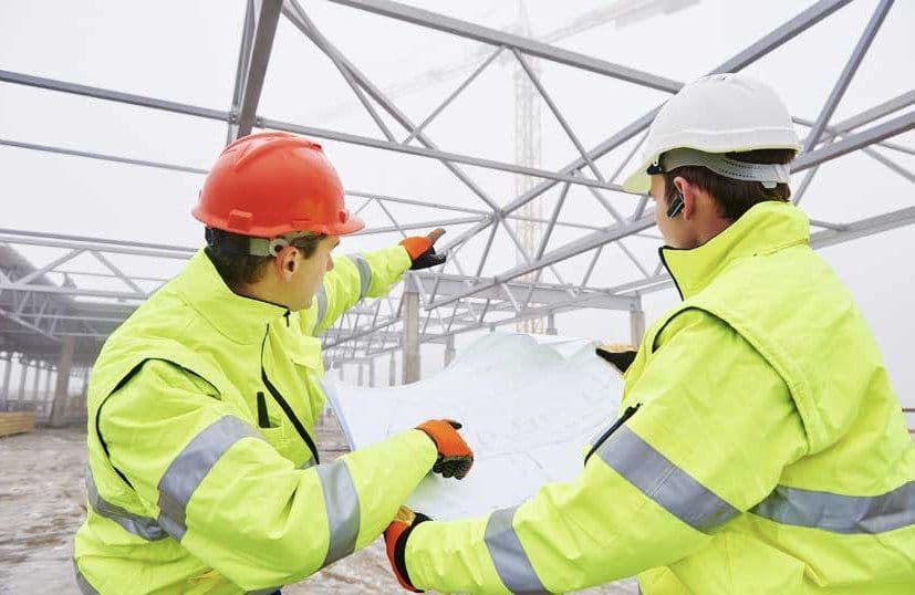 Health and safety professionals discussing workplace controls